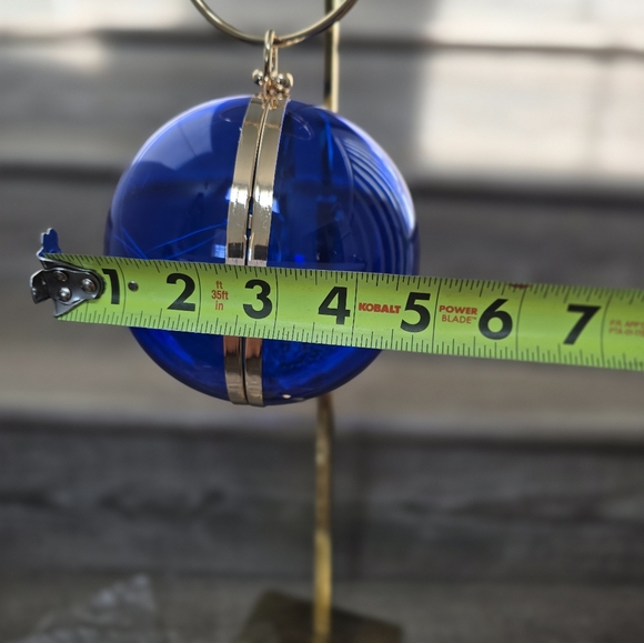 Cobalt blue wristlet round ball, gold trim and gold crossbody chain. - Picture 9 of 9